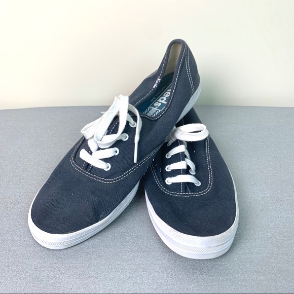 navy blue and white keds